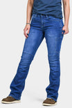 Dovetail Workwear DX Bootcut Pant in Blue Sky Denim displayed on a woman wearing a navy top and brown boots, showing the full-length bootcut silhouette with visible nested pockets and articulated knee detailing