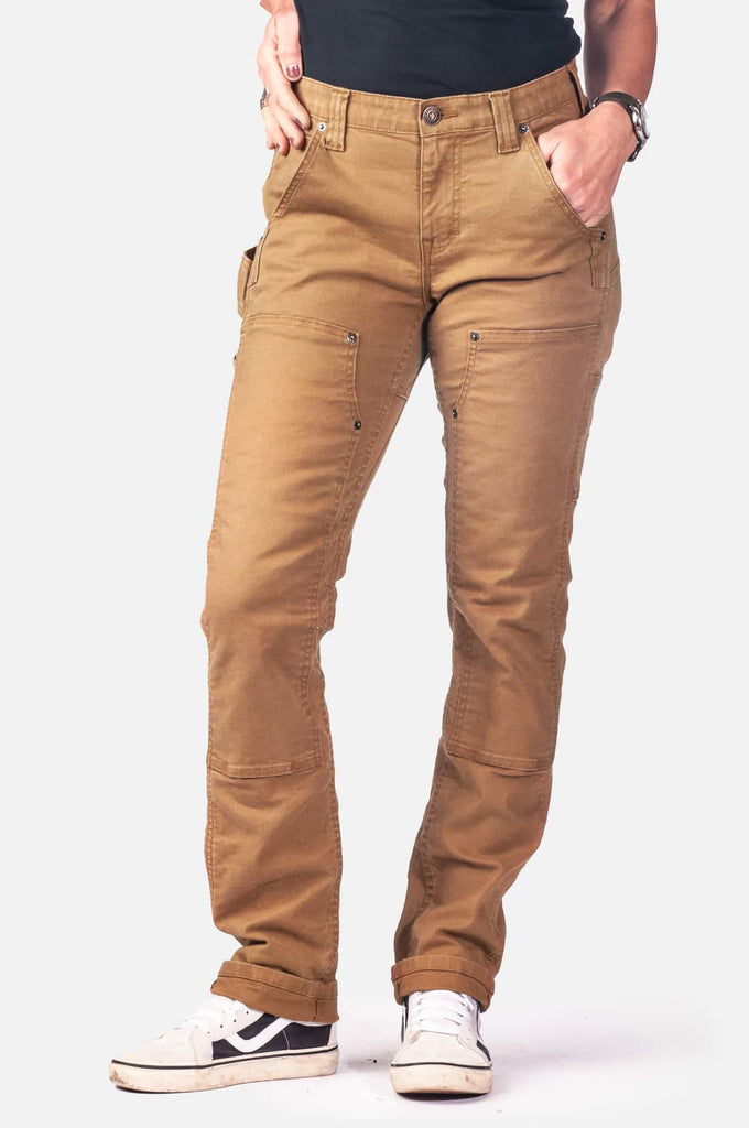 Maven X Pant in Saddle Brown Canvas by Dovetail Workwear, shown on a woman with reinforced knees, tool loop, and nested pockets in a slim fit