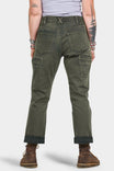 Back view of a woman wearing Dovetail Workwear's Shop Pant in Olive Green Denim, showing cargo pockets, high-rise waist, and rolled cuffs with brown boots