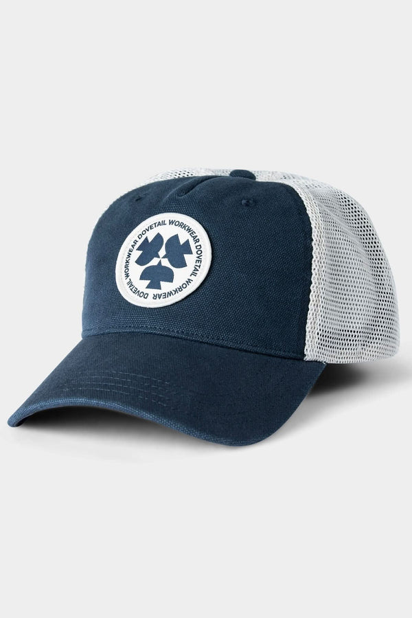 Navy Dovetail Workwear Trucker Hat with breathable mesh back panels and circular Dovetail patch logo, displayed on angled view against neutral background