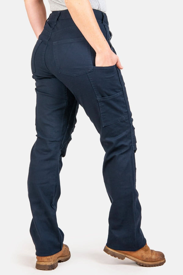 Back view of a woman wearing Dovetail Workwear's Anna Taskpant in Uniform Navy Canvas, showcasing Nested Pockets, Reinforced Knees, and a Straight Leg silhouette