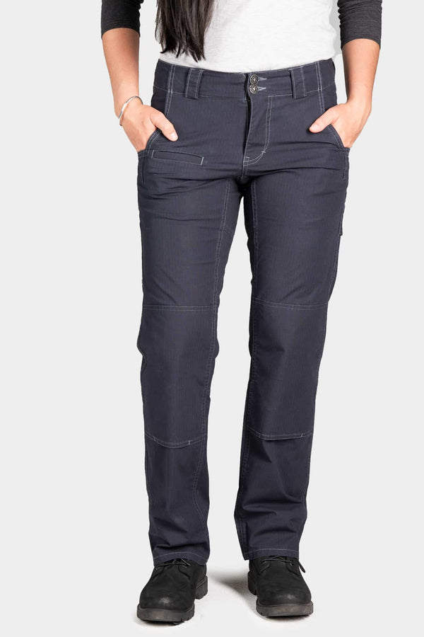 Day Construct Pant in Lightweight Dark Navy Ripstop by Dovetail Workwear, shown on a woman with hands in pockets, featuring reinforced knees and relaxed straight-leg fit