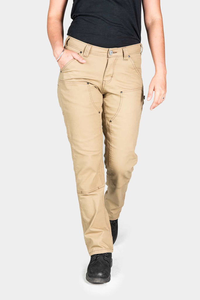 Anna Taskpant in Khaki Canvas by Dovetail Workwear shown on a woman wearing a black tank top, highlighting the straight leg fit, reinforced knees, and Hip Slot™ Tool loop