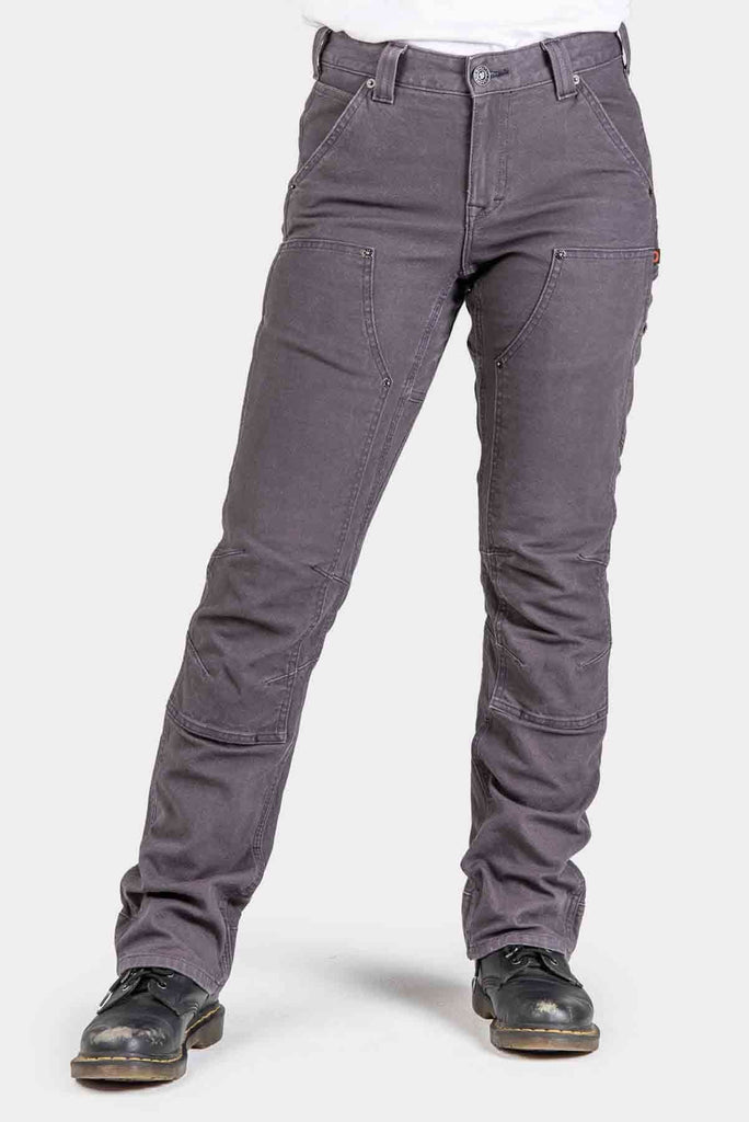 Woman wearing Dovetail Workwear Britt Utility Pants in Dark Grey Canvas with reinforced knees, tool loop, and straight leg silhouette
