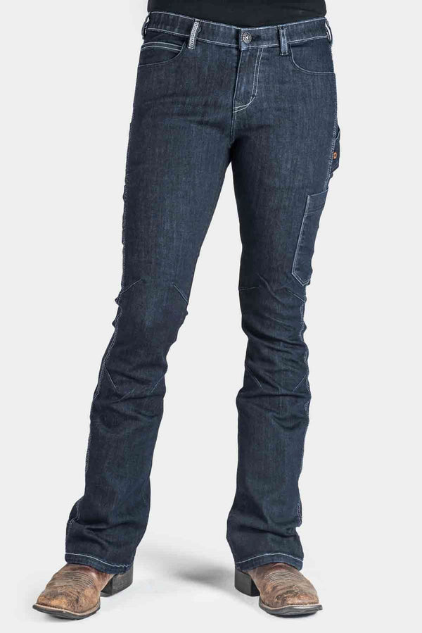 DX Bootcut Pant in CORDURA® Indigo Denim by Dovetail Workwear shown on woman wearing cowboy boots, featuring visible tool loops and nested pockets