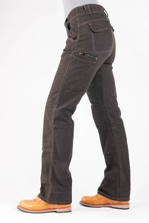 Side view of a woman wearing Dovetail Workwear's Day Construct Pant in Brown Canvas, showing reinforced knees, phone pocket, and relaxed straight-leg fit with tough cuff hem