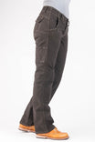 Side view of a woman wearing Dovetail Workwear's Day Construct Pant in Brown Canvas, showcasing multiple pockets, reinforced knees, and relaxed straight-leg fit with work boots