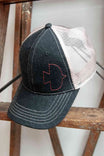 Dovetail Embroidered Shop Cap in blue denim and cream mesh, displayed on a wooden stand showing the contrasting embroidered Dovetail logo on the front