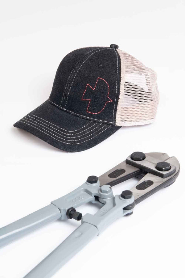 Detail view of the Dovetail Embroidered Shop Cap in Blue/Black showing the adjustable mesh back panel and contrast stitching on the embroidered Dovetail logo from Dovetail Workwear