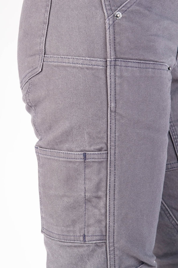 Detail shot of the Britt Utility Pants in Dark Grey Canvas by Dovetail Workwear, highlighting nested pockets, tool loop, and reinforced knee articulation